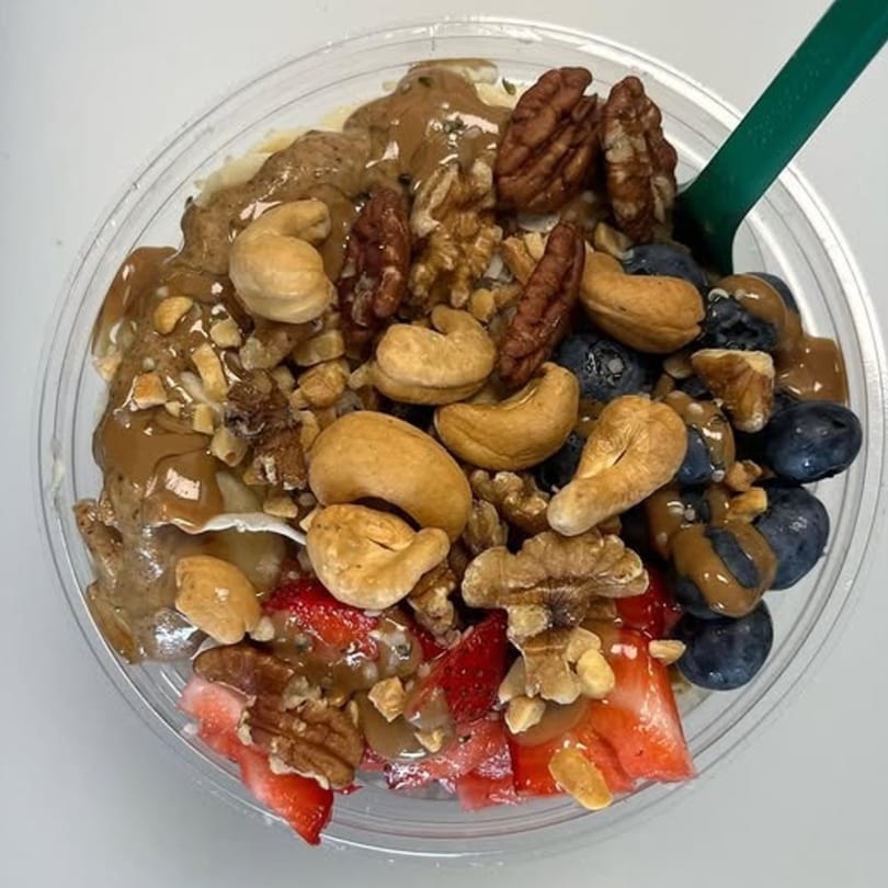 A Vytal Nutrition smoothie bowl with cashews, pecans, walnuts, blueberries, and strawberries.