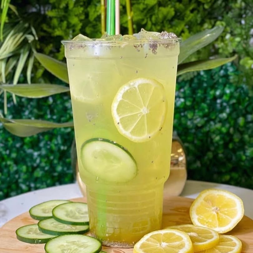 A Vytal Nutrition cucumber and lemon drink with chia seeds, ice, and green straws.